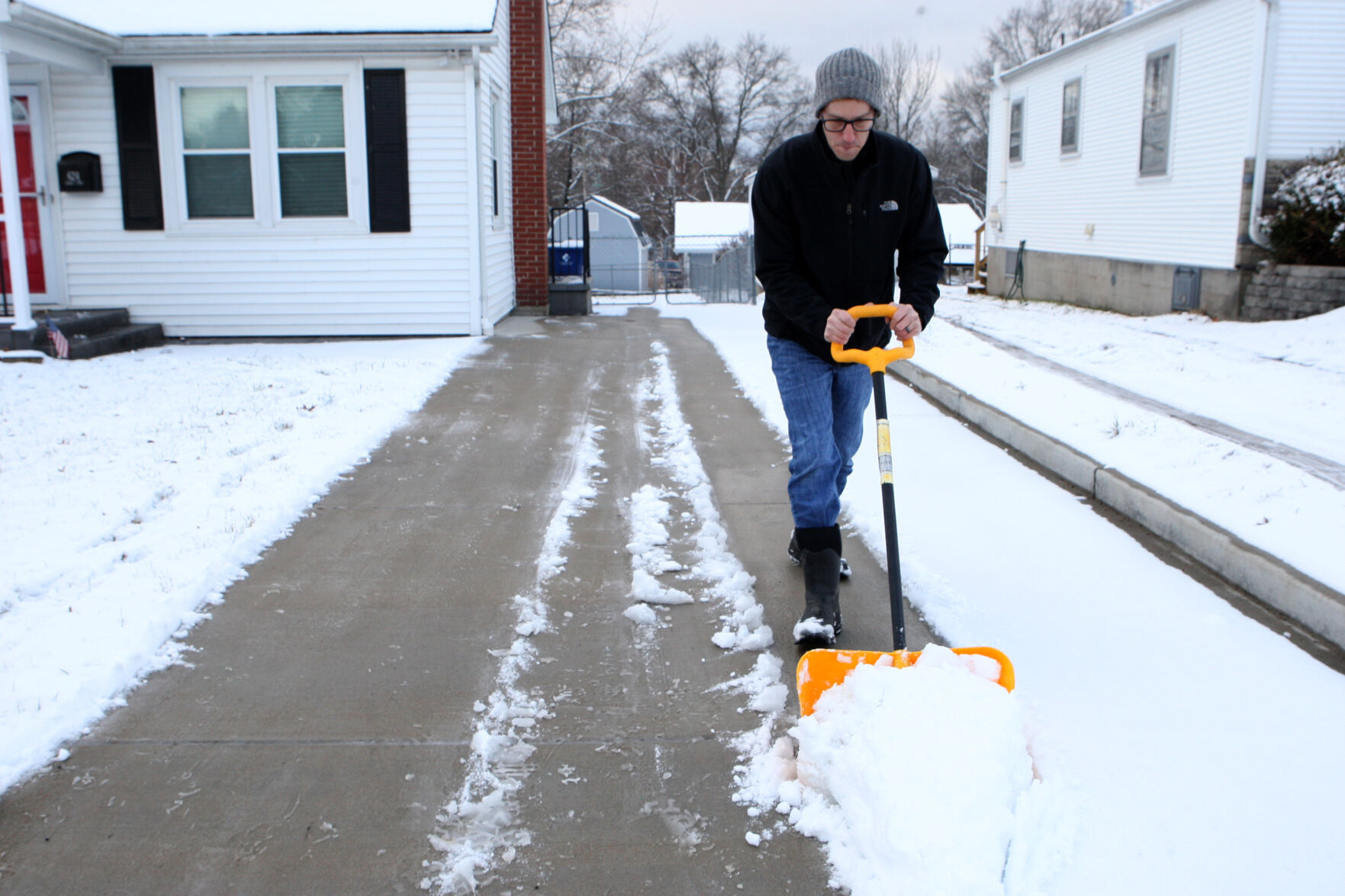 Mike Halmich shovels snow
